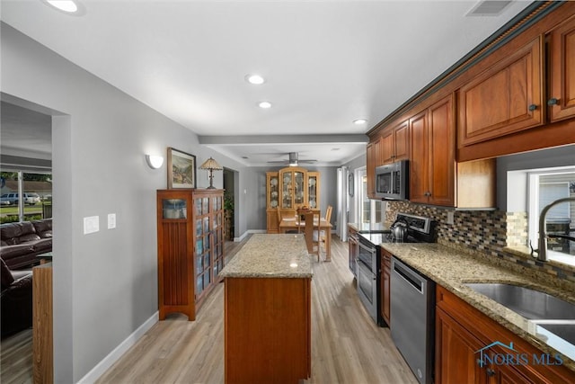 855 Strotz Dr, Toledo, OH 43612 - kitchen featuring stainless steel appliances, backsplash, light wood finished floors, plenty of natural light, and recessed lighting