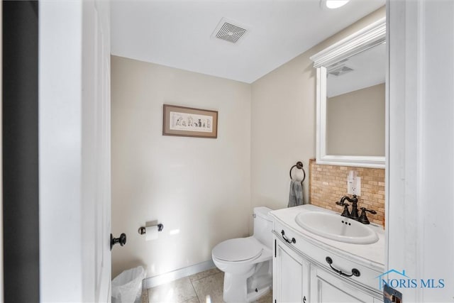 855 Strotz Dr, Toledo, OH 43612 - bathroom with tasteful backsplash, vanity, and tile patterned floors