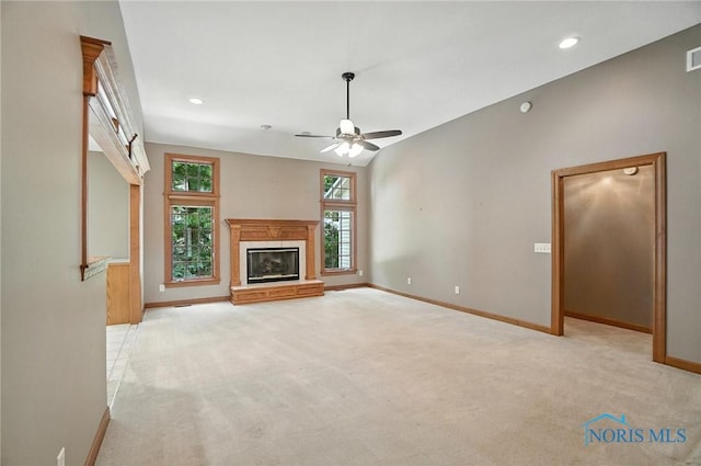 8076 Trent Lock Dr, Waterville, OH 43566 - unfurnished living room with light carpet, a glass covered fireplace, ceiling fan, and recessed lighting