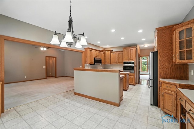 8076 Trent Lock Dr, Waterville, OH 43566 - kitchen featuring stainless steel appliances, brown cabinets, glass insert cabinets, a chandelier, and decorative light fixtures