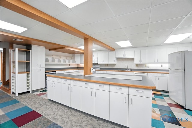 8076 Trent Lock Dr, Waterville, OH 43566 - kitchen with white appliances, open shelves, a drop ceiling, white cabinetry, and beverage cooler