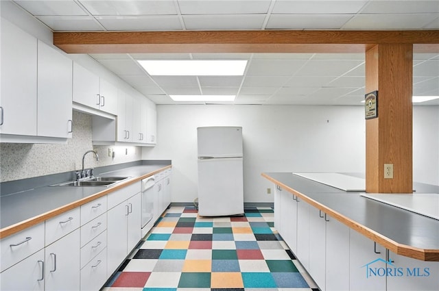 8076 Trent Lock Dr, Waterville, OH 43566 - kitchen with white appliances, light floors, a paneled ceiling, and white cabinetry