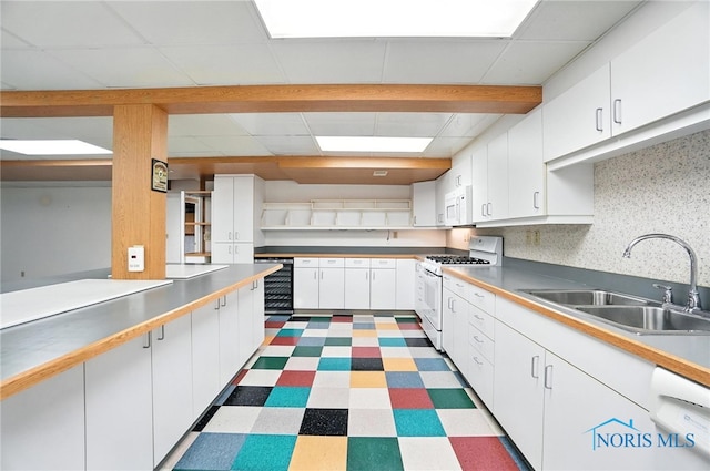 8076 Trent Lock Dr, Waterville, OH 43566 - kitchen featuring white appliances, tile patterned floors, white cabinetry, and a paneled ceiling