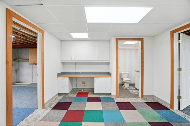 8076 Trent Lock Dr, Waterville, OH 43566 - office area featuring built in study area, a paneled ceiling, and light floors