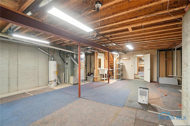 8076 Trent Lock Dr, Waterville, OH 43566 - unfinished below grade area featuring gas water heater, brick wall, and heating unit