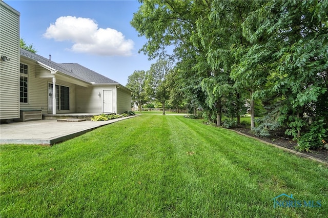 8076 Trent Lock Dr, Waterville, OH 43566 - view of grassy yard with a patio