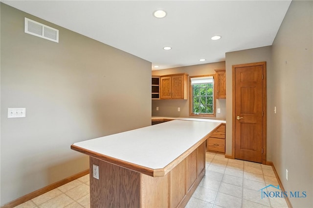 8076 Trent Lock Dr, Waterville, OH 43566 - kitchen featuring light countertops, a center island, recessed lighting, open shelves, and light tile patterned floors