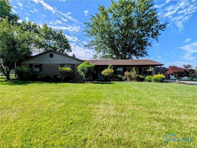 209 Hawthorn Dr, Archbold, OH 43502 - ranch-style home with a front yard