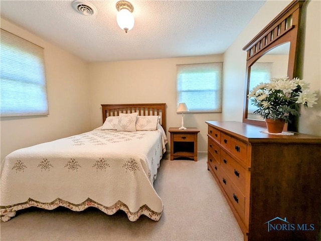209 Hawthorn Dr, Archbold, OH 43502 - bedroom with light colored carpet and a textured ceiling