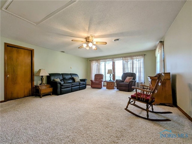 209 Hawthorn Dr, Archbold, OH 43502 - living room with carpet, a textured ceiling, and a ceiling fan