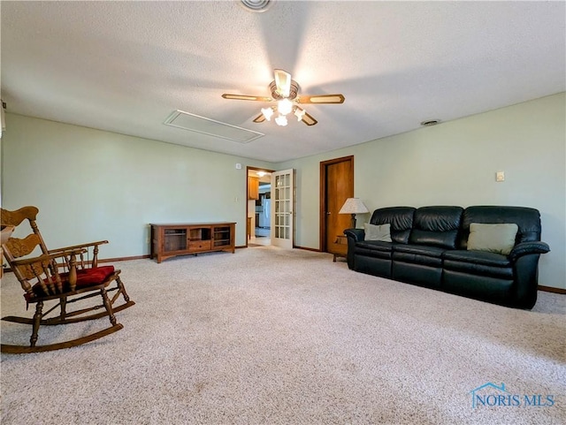 209 Hawthorn Dr, Archbold, OH 43502 - living area with ceiling fan, light carpet, attic access, and a textured ceiling