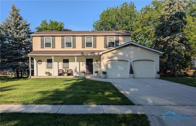 1768 Cambridge Park E, Maumee, OH 43537 - view of front of property with a porch, a garage, a front lawn, and concrete driveway