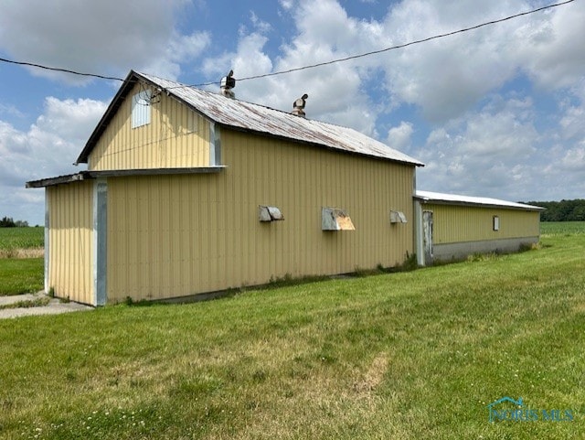 18375 County Road R, Alvordton, OH 43501 - view of home's exterior featuring a yard, a pole building, and an outdoor structure