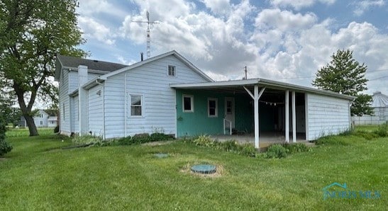 18375 County Road R, Alvordton, OH 43501 - back of house featuring a yard and a patio area