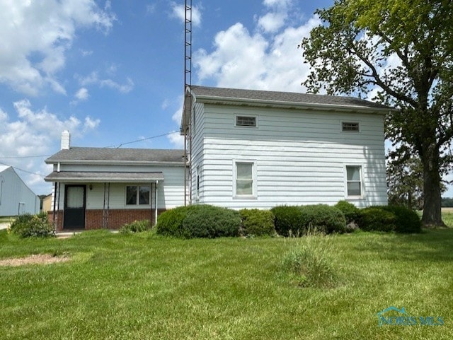 18375 County Road R, Alvordton, OH 43501 - rear view of property featuring a yard and a chimney
