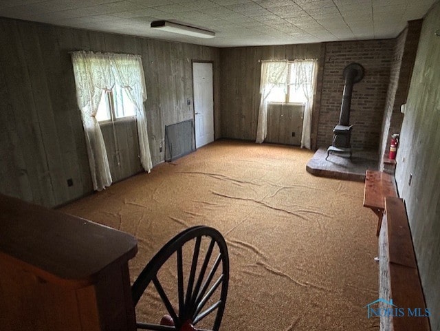 18375 County Road R, Alvordton, OH 43501 - living room with a wood stove and carpet floors