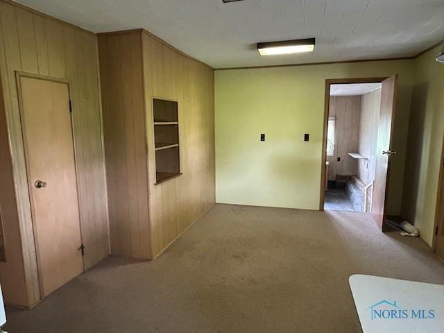 18375 County Road R, Alvordton, OH 43501 - hallway with wooden walls and carpet flooring
