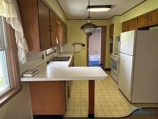 18375 County Road R, Alvordton, OH 43501 - kitchen featuring white appliances, light countertops, and a peninsula