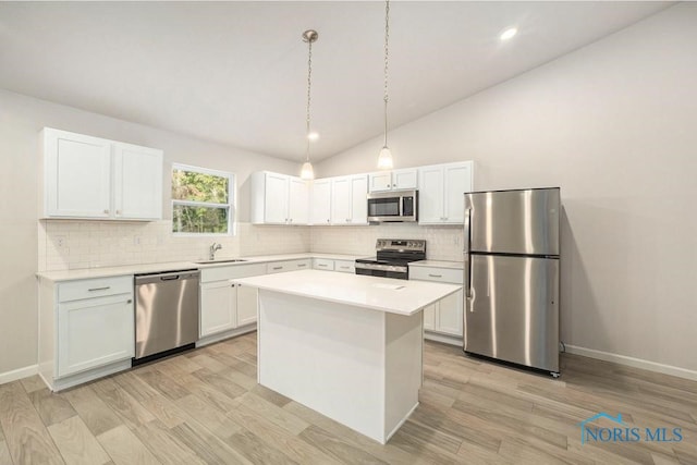 1487 Lee Ann Ave, Defiance, OH 43512 - kitchen featuring stainless steel appliances, backsplash, light countertops, light wood-type flooring, and vaulted ceiling