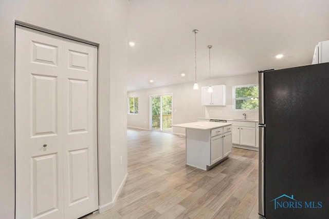 1487 Lee Ann Ave, Defiance, OH 43512 - kitchen featuring freestanding refrigerator, light wood-style flooring, plenty of natural light, a center island, and recessed lighting