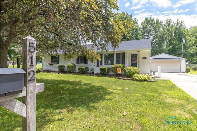 512 State St, Elmore, OH 43416 - view of front of house with an outbuilding, a garage, and a front yard