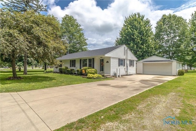 512 State St, Elmore, OH 43416 - ranch-style house with an outdoor structure, a detached garage, and a front lawn