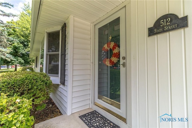 512 State St, Elmore, OH 43416 - entrance to property featuring board and batten siding