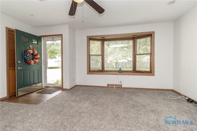 512 State St, Elmore, OH 43416 - carpeted entrance foyer featuring baseboards and a ceiling fan