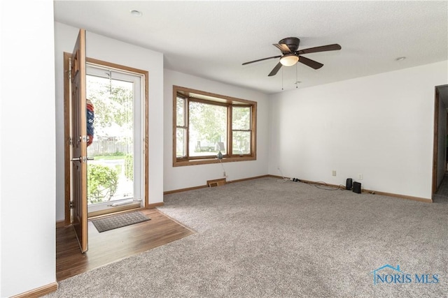 512 State St, Elmore, OH 43416 - unfurnished living room with carpet floors, healthy amount of natural light, and ceiling fan