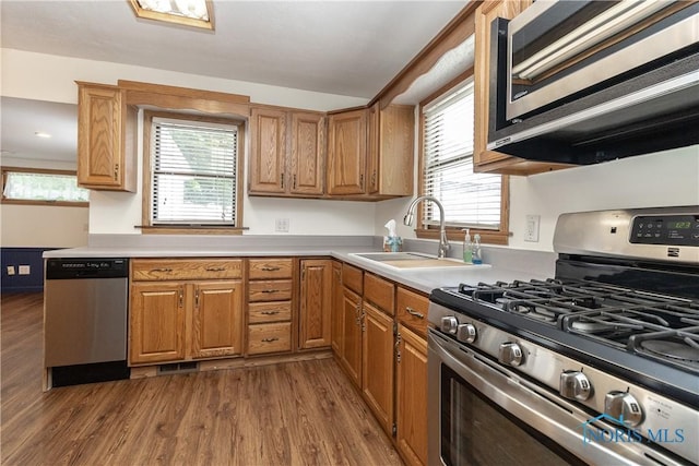 512 State St, Elmore, OH 43416 - kitchen featuring stainless steel appliances, dark wood-style flooring, light countertops, and plenty of natural light