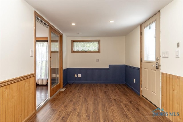 512 State St, Elmore, OH 43416 - spare room with a wainscoted wall, wood finished floors, wooden walls, and recessed lighting