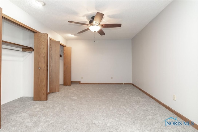 512 State St, Elmore, OH 43416 - unfurnished bedroom with light carpet, a closet, and ceiling fan