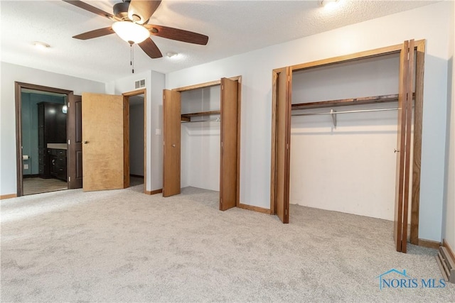 512 State St, Elmore, OH 43416 - unfurnished bedroom with two closets, carpet floors, connected bathroom, and a ceiling fan