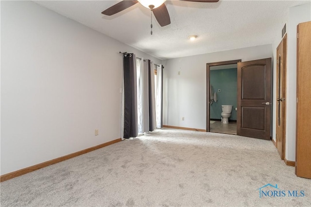 512 State St, Elmore, OH 43416 - unfurnished bedroom featuring carpet, ensuite bath, and ceiling fan