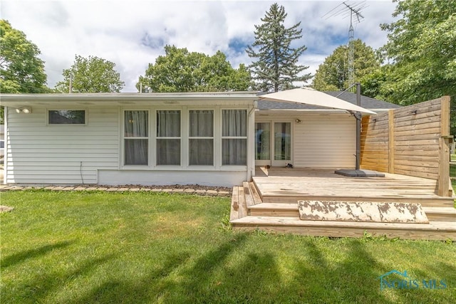 512 State St, Elmore, OH 43416 - rear view of house featuring a deck and a yard