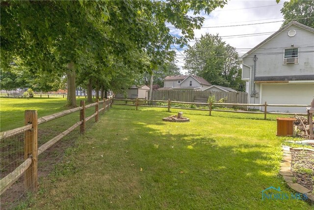 512 State St, Elmore, OH 43416 - view of yard featuring an attached garage