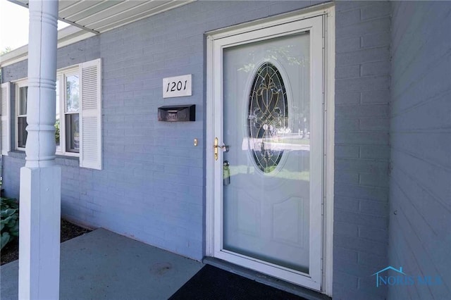 1201 S Blanchard St, Findlay, OH 45840 - entrance to property featuring brick siding and a porch