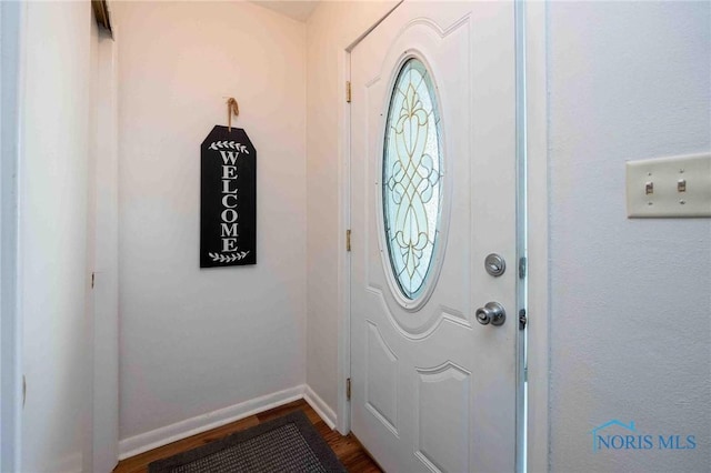 1201 S Blanchard St, Findlay, OH 45840 - entrance foyer with dark wood finished floors and baseboards