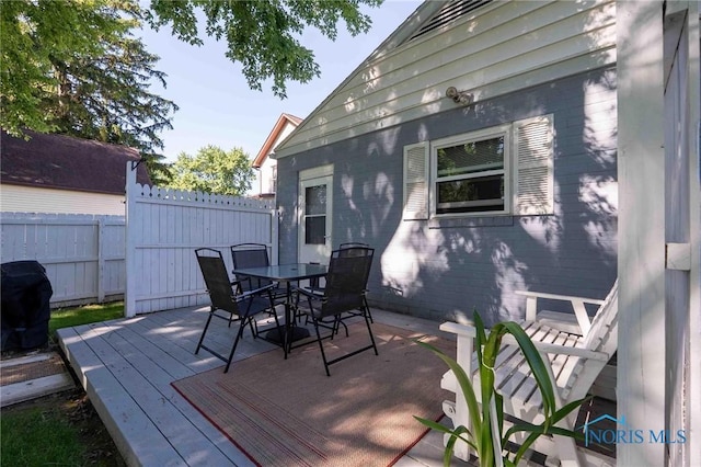 1201 S Blanchard St, Findlay, OH 45840 - wooden terrace featuring outdoor dining space and a grill