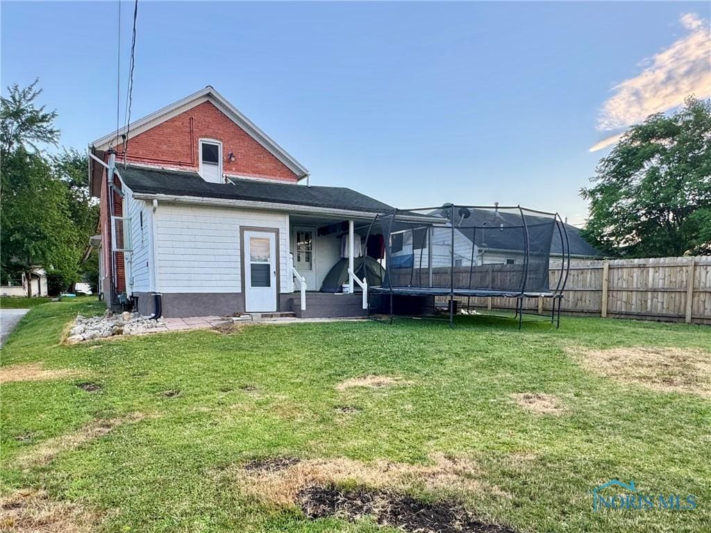 310 Hopkins St, Defiance, OH 43512 - rear view of property featuring a trampoline