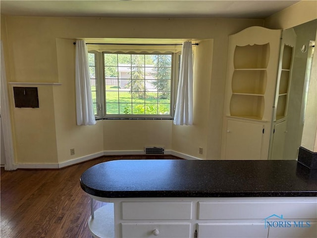 610 E High St, Defiance, OH 43512 - dining area with dark wood-style floors and baseboards