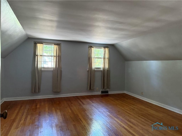 610 E High St, Defiance, OH 43512 - additional living space with lofted ceiling, wood finished floors, and healthy amount of natural light