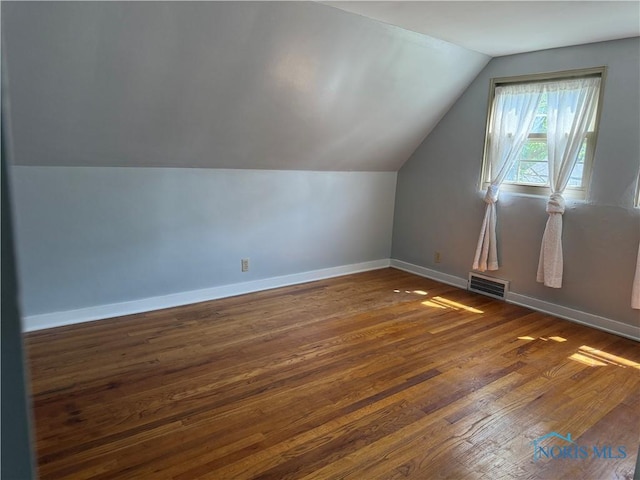 610 E High St, Defiance, OH 43512 - additional living space featuring lofted ceiling and hardwood / wood-style floors