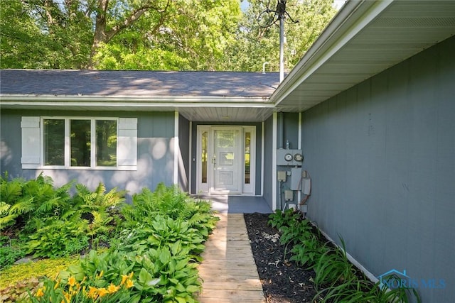 639 S Main St, Swanton, OH 43558 - doorway to property with roof with shingles