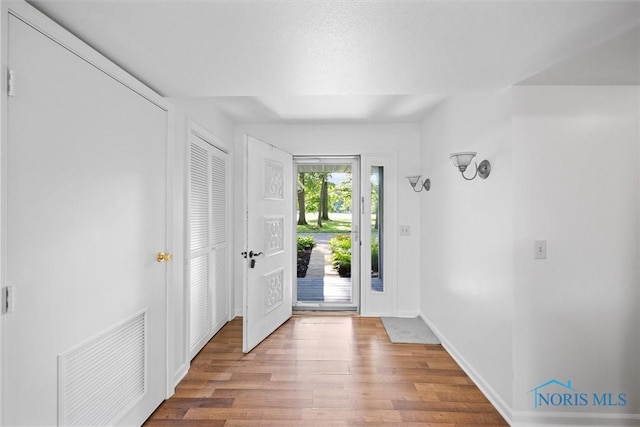 639 S Main St, Swanton, OH 43558 - entryway featuring wood finished floors and baseboards