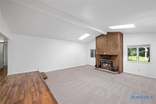639 S Main St, Swanton, OH 43558 - unfurnished living room featuring plenty of natural light and a fireplace