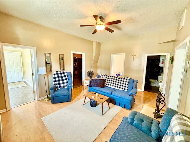 307 Spencerville St, Hicksville, OH 43526 - living room featuring wood finished floors, a ceiling fan, and a textured ceiling