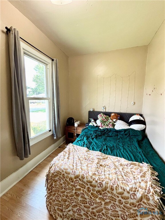 307 Spencerville St, Hicksville, OH 43526 - bedroom with wood finished floors and baseboards