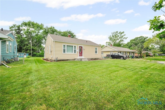 1247 Hugo St, Maumee, OH 43537 - view of front of house featuring a chimney