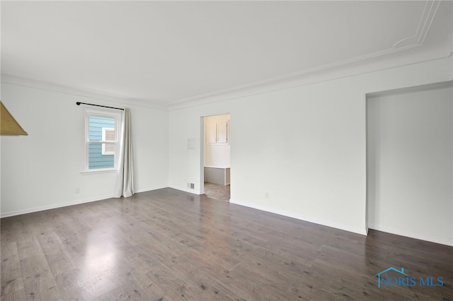 1247 Hugo St, Maumee, OH 43537 - empty room featuring dark wood finished floors and baseboards